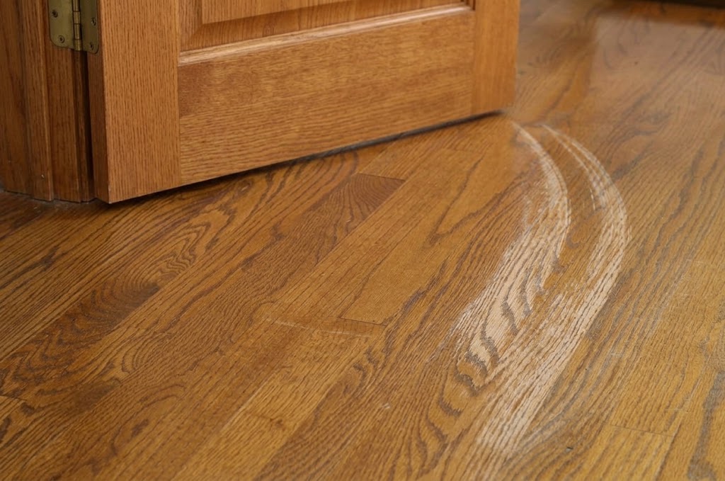 floor damaged by poorly aligned door